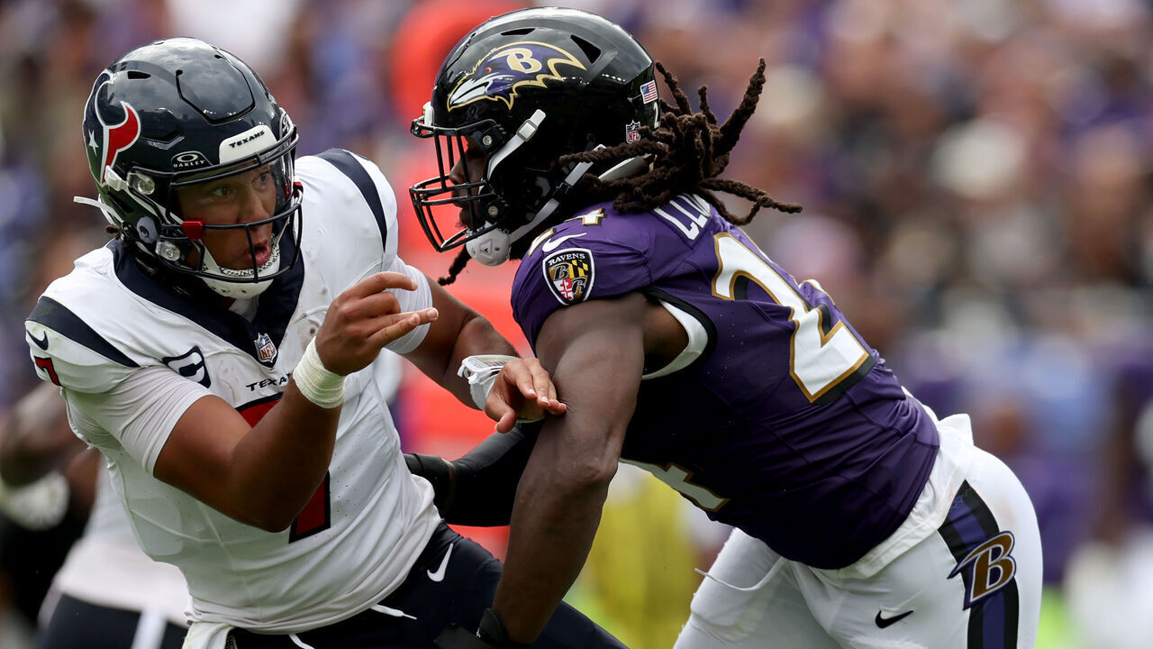 BALTIMORE, MARYLAND - SEPTEMBER 10: Quarterback C.J. Stroud #7 of the Houston Texans is pressured by Jadeveon Clowney #24 of the Baltimore Ravens at M&T Bank Stadium on September 10, 2023 in Baltimore, Maryland.