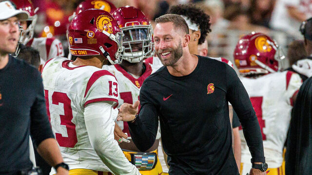 TEMPE, AZ - SEPTEMBER 23: USC Trojans Senior Offensive Analyst Kliff Kingsbury congratulates USC Trojans quarterback Caleb Williams (13) during the NCAA College Football game between the USC Trojans and Arizona State Sun Devils on Saturday, September 23, 2023 at Mountain America Stadium in Tempe, Arizona.