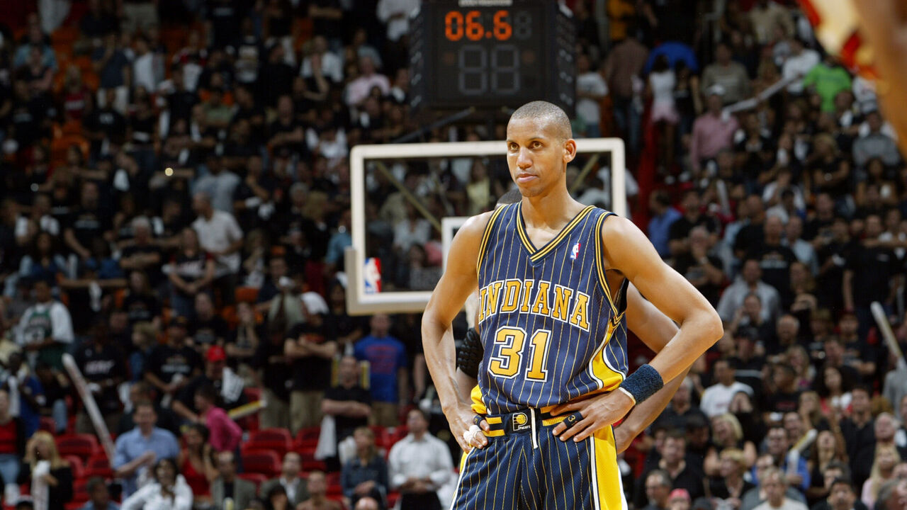 MIAMI - MAY 10: Reggie Miller #31 of the Indiana Pacers looks on dejected during a loss against the Miami Heat in Game three of the Eastern Conference Semifinals during the 2004 NBA Playoffs at the American Airlines Arena on May 10, 2004 in Miami, Florida. NOTE TO USER: User expressly acknowledges and agrees that, by downloading and/or using this Photograph, user is consenting to the terms and conditions of the Getty Images License Agreement. Mandatory Copyright Notice: Copyright 2004 NBAE