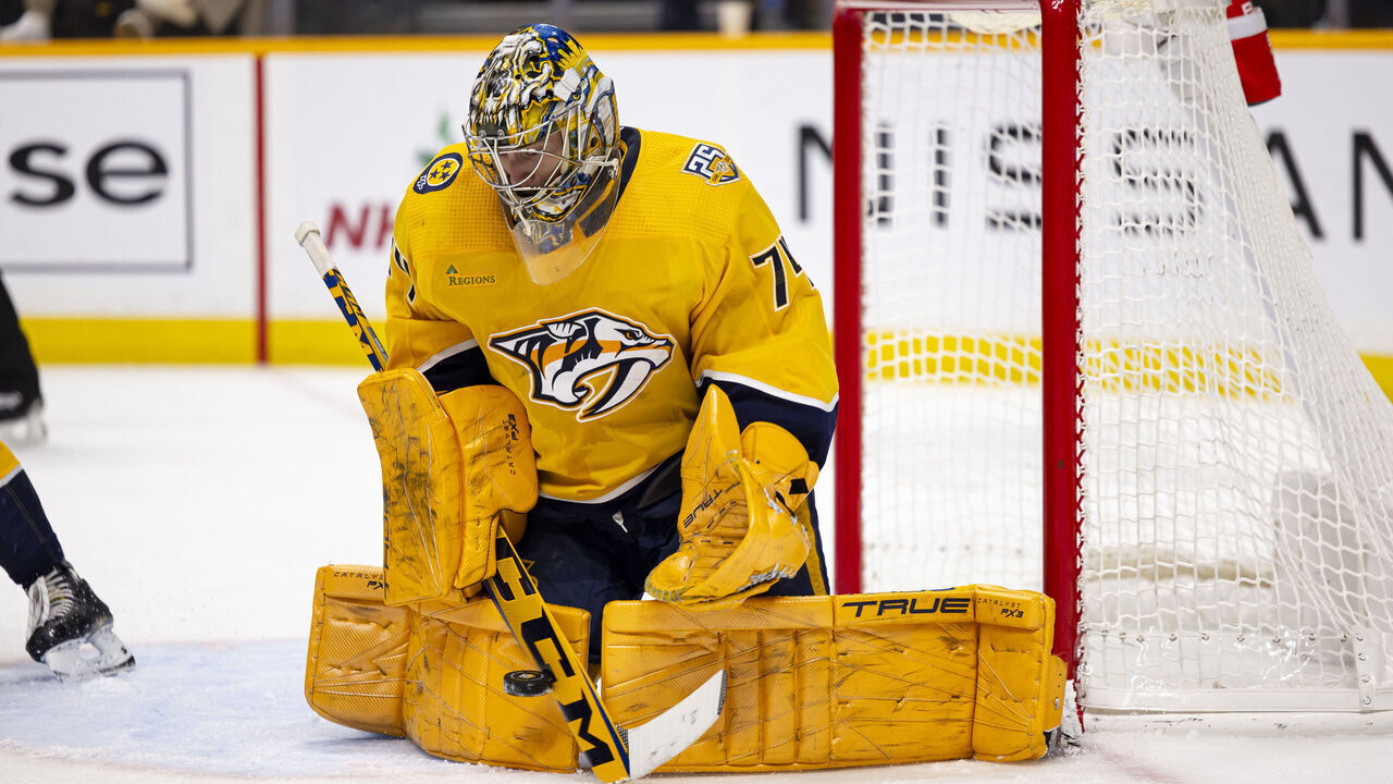 NASHVILLE, TENNESSEE - DECEMBER 7: Juuse Saros #74 of the Nashville Predators saves a shot by the Tampa Bay Lightning during the second period at Bridgestone Arena on December 7, 2023 in Nashville, Tennessee.