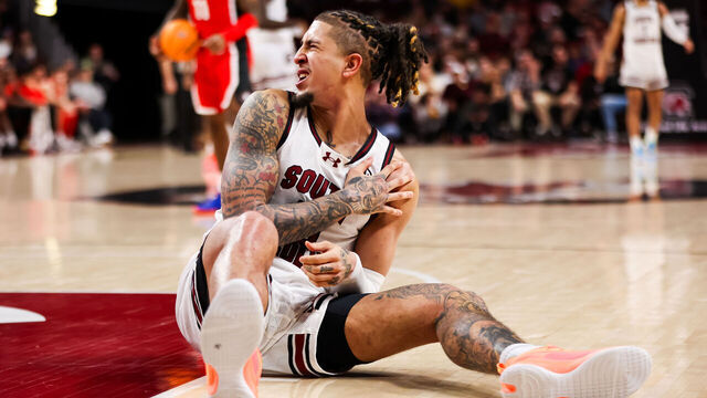 COLUMBIA, SC - JANUARY 16: Myles Stute #10 of the South Carolina Gamecocks holds his shoulder after hitting the ground during a basketball game against the Georgia Bulldogs at Colonial Life Arena on January 16, 2024 in Columbia, SC.
