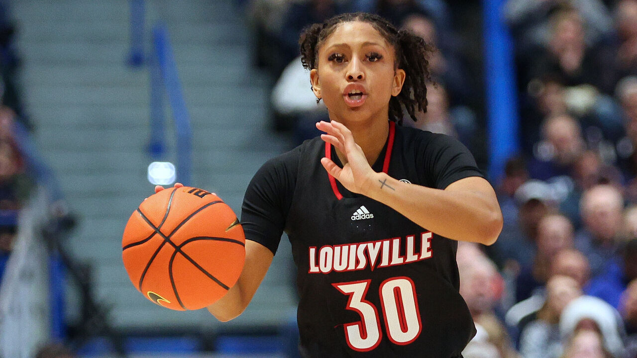 HARTFORD, CT - DECEMBER 16: Louisville Cardinals guard Jayda Curry (30) dribbles the ball up court during the women's college basketball game between Louisville Cardinals and UConn Huskies on December 16, 2023, at the XL Center in Hartford, CT.