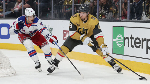 LAS VEGAS, NEVADA - JANUARY 18: Ivan Barbashev #49 of the Vegas Golden Knights skates against Braden Schneider #4 of the New York Rangers during the second period at T-Mobile Arena on January 18, 2024 in Las Vegas, Nevada.