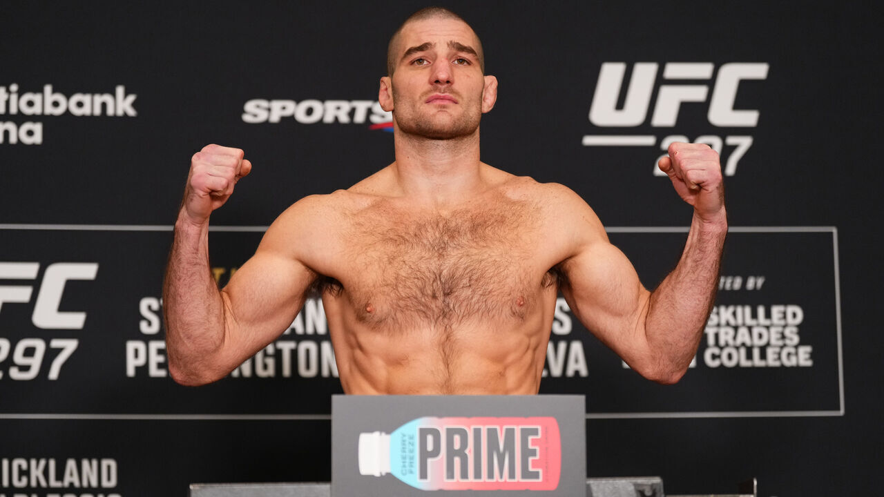 TORONTO, ONTARIO - JANUARY 19: Sean Strickland poses on the scale during the UFC 297 official weigh-in at the Marriott Downtown at CF Eaton Centre on January 19, 2024 in Toronto, Ontario.
