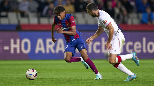 BARCELONA, SPAIN - OCTOBER 22: Lamine Yamal of FC Barcelona competes for the ball with Inigo Lekue of Athletic Club during the LaLiga EA Sports match between FC Barcelona and Athletic Bilbao at Estadi Olimpic Lluis Companys on October 22, 2023 in Barcelona, Spain.