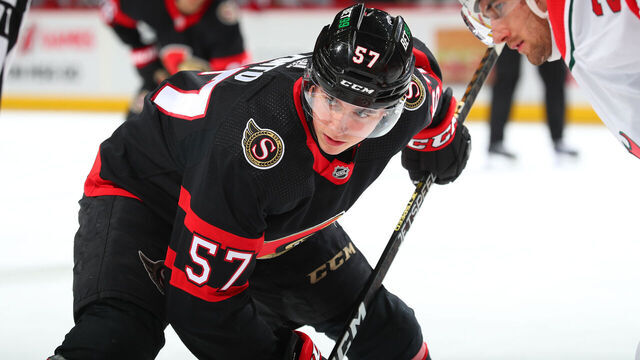 NEWARK, NJ - MARCH 25: Shane Pinto #57 of the Ottawa Senators gets ready to take a faceoff in the second period of the game against the New Jersey Devils at the Prudential Center on March 25, 2023 in Newark, New Jersey.