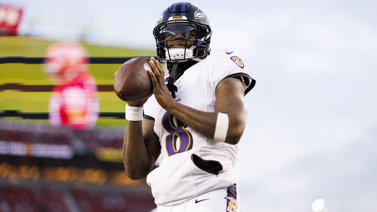 SANTA CLARA, CALIFORNIA - DECEMBER 25: Lamar Jackson #8 of the Baltimore Ravens looks to throw a pass during pregame warmups before an NFL football game against the San Francisco 49ers at Levi's Stadium on December 25, 2023 in Santa Clara, California.