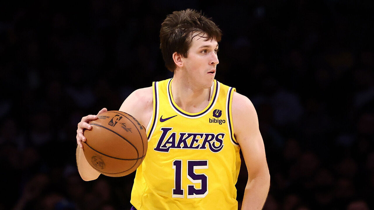 LOS ANGELES, CALIFORNIA - JANUARY 17: Austin Reaves #15 of the Los Angeles Lakers brings the ball up court during the fourth quarter against the Dallas Mavericks at Crypto.com Arena on January 17, 2024 in Los Angeles, California.