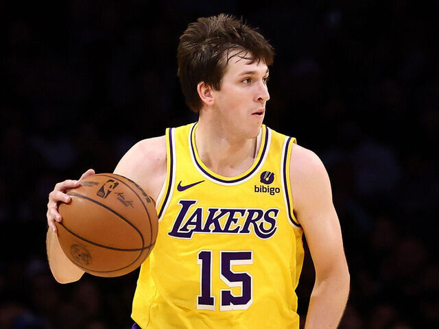 LOS ANGELES, CALIFORNIA - JANUARY 17: Austin Reaves #15 of the Los Angeles Lakers brings the ball up court during the fourth quarter against the Dallas Mavericks at Crypto.com Arena on January 17, 2024 in Los Angeles, California.