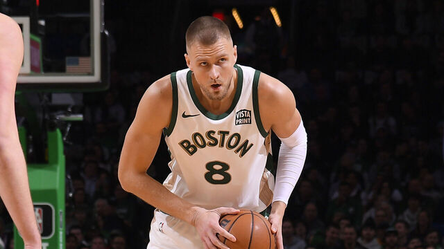 BOSTON, MA - JANUARY 19: Kristaps Porzingis #8 of the Boston Celtics handles the ball during the game against the Denver Nuggets on January 19, 2024 at the TD Garden in Boston, Massachusetts. Mandatory Copyright Notice: Copyright 2024 NBAE