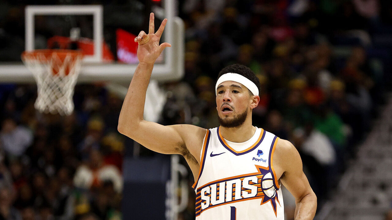 NEW ORLEANS, LOUISIANA - JANUARY 19: Devin Booker #1 of the Phoenix Suns reacts after scoring a three point basket during the third quarter of an NBA game against the New Orleans Pelicans at Smoothie King Center on January 19, 2024 in New Orleans, Louisiana.