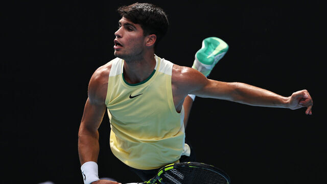 MELBOURNE, AUSTRALIA - JANUARY 20: Carlos Alcaraz of Spain serves in their round three singles match against Juncheng Shang of China during the 2024 Australian Open at Melbourne Park on January 20, 2024 in Melbourne, Australia.