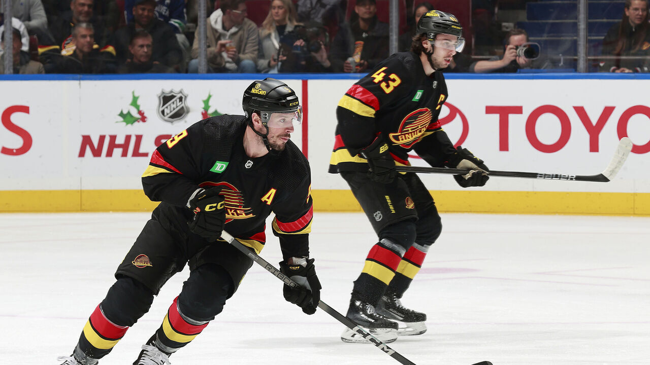 VANCOUVER, CANADA - DECEMBER 12: Quinn Hughes #43 and J.T. Miller #9 of the Vancouver Canucks skate up ice during their NHL game against the Tampa Bay Lightning at Rogers Arena on December 12, 2023 in Vancouver, British Columbia, Canada.
