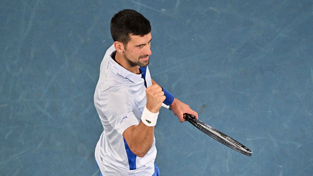 Serbia's Novak Djokovic celebrates after victory against France's Adrian Mannarino during their men's singles match on day eight of the Australian Open tennis tournament in Melbourne on January 21, 2024.