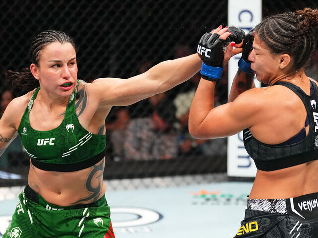 TORONTO, ONTARIO - JANUARY 20: (L-R) Raquel Pennington punches Mayra Bueno Silva of Brazil in a UFC bantamweight championship bout during the UFC 297 event at Scotiabank Arena on January 20, 2024 in Toronto, Ontario.