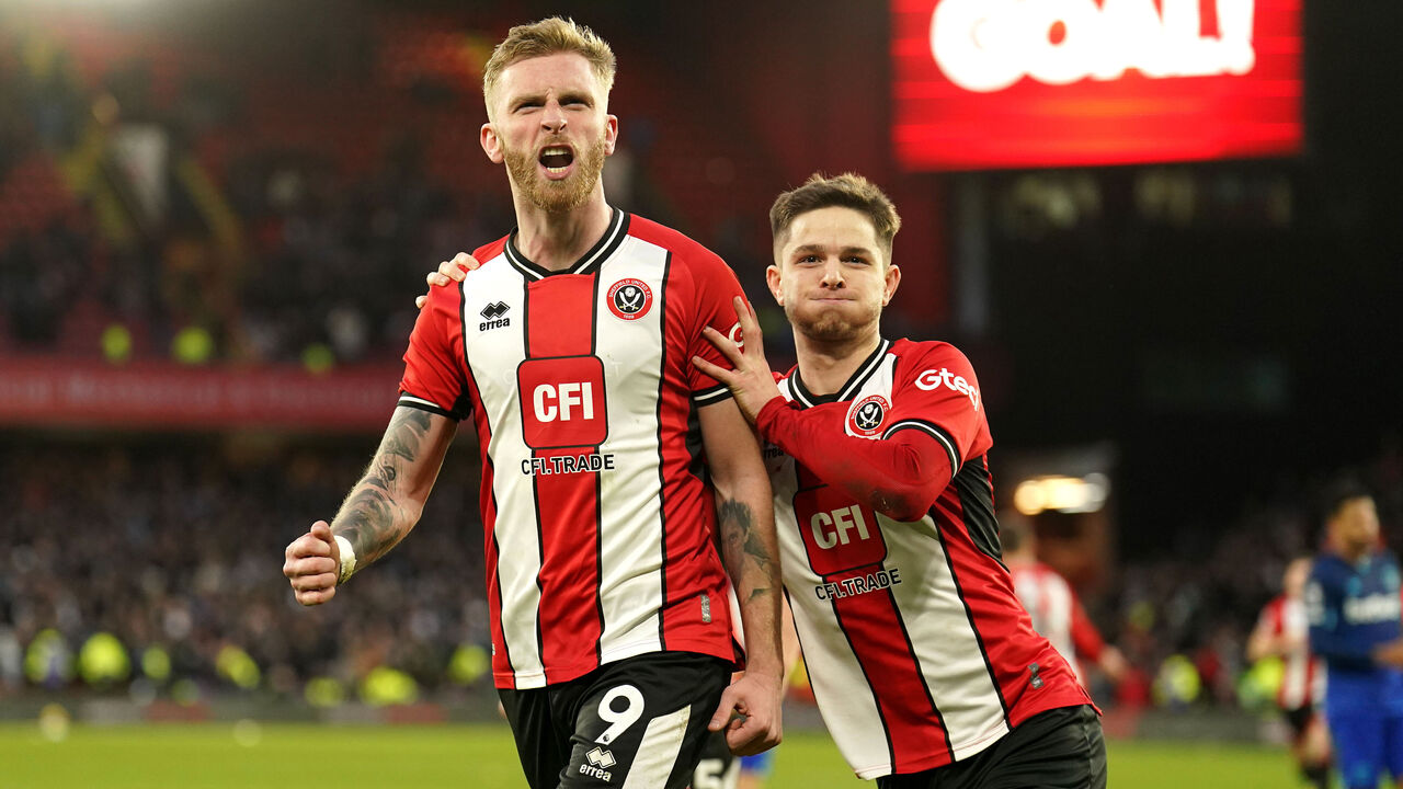 Sheffield United's Oli McBurnie (left) celebrates scoring their side's second goal of the game from a penalty kick with team-mates during the Premier League match at Bramall Lane, Sheffield. Picture date: Sunday January 21, 2024.