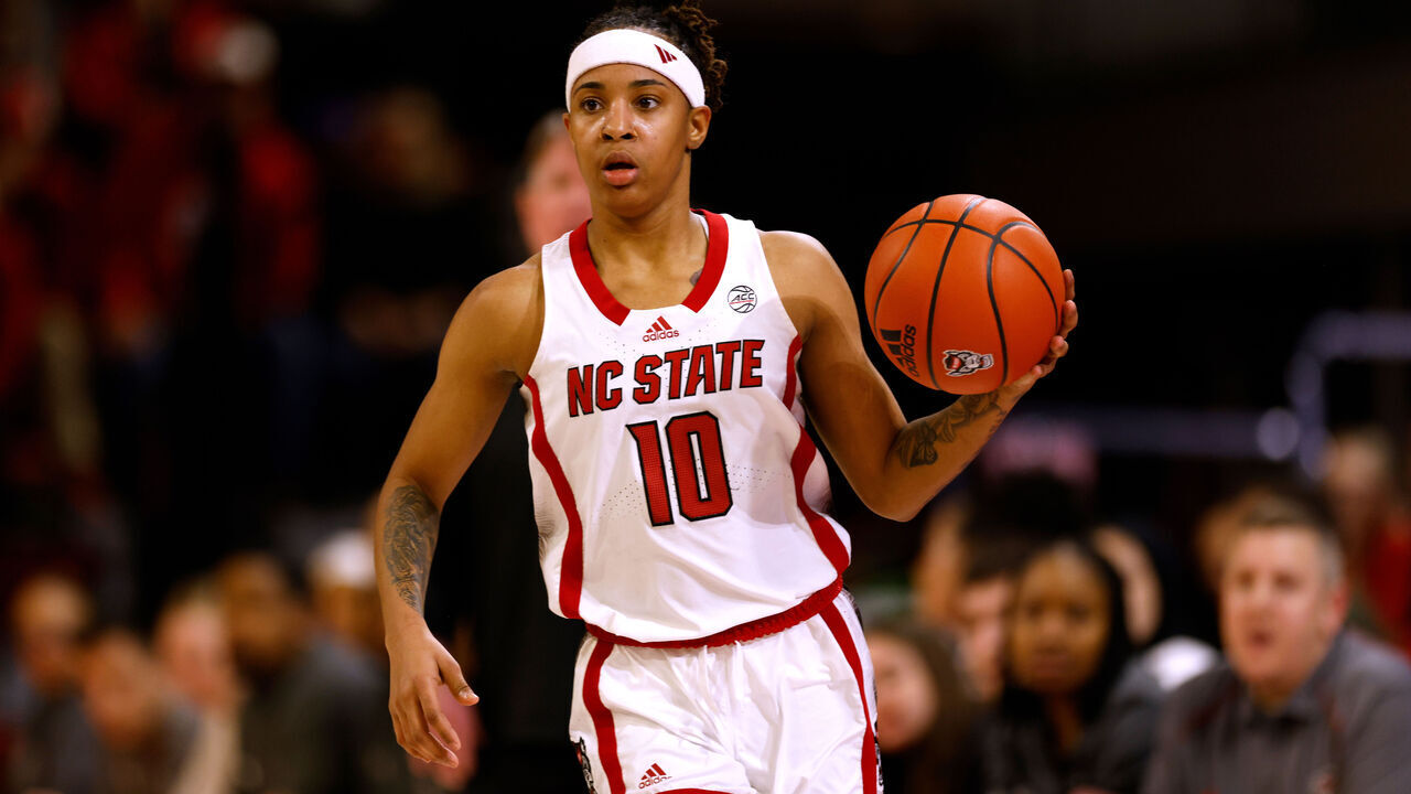 RALEIGH, NORTH CAROLINA - JANUARY 11: Aziaha James #10 of the NC State Wolfpack dribbles up court against the Virginia Cavaliers at Reynolds Coliseum on January 11, 2024 in Raleigh, North Carolina. NC State won 93-66.