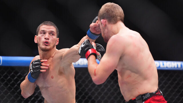 TORONTO, ONTARIO - JANUARY 20: (L-R) Movsar Evloev of Russia punches Arnold Allen of England in a featherweight bout during the UFC 297 event at Scotiabank Arena on January 20, 2024 in Toronto, Ontario.