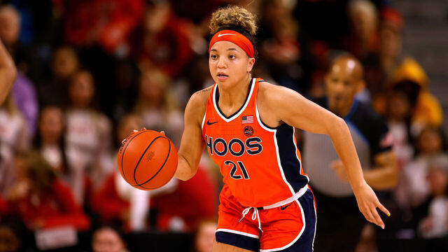 RALEIGH, NORTH CAROLINA - JANUARY 11: Kymora Johnson #21 of the Virginia Cavaliers dribbles up court against the NC State Wolfpack at Reynolds Coliseum on January 11, 2024 in Raleigh, North Carolina. NC State won 93-66.