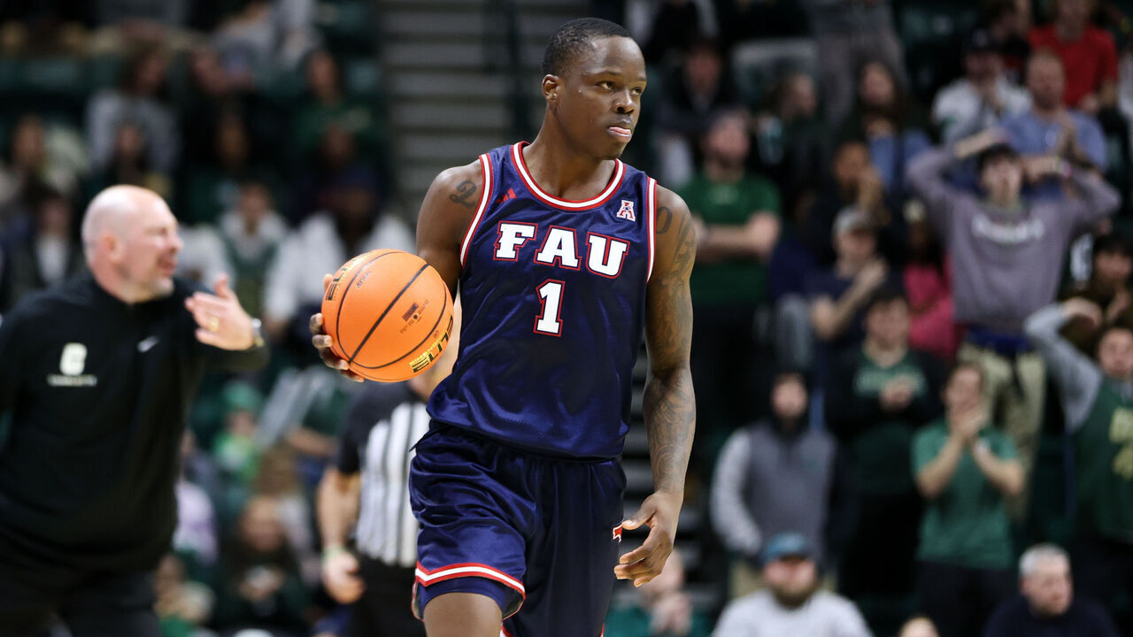 CHARLOTTE, NORTH CAROLINA - JANUARY 6: Johnell Davis #1 of the Florida Atlantic Owls moves the ball against the Charlotte 49ers at Dale F. Halton Arena on January 6, 2024 in Charlotte, North Carolina.