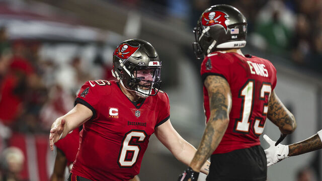 TAMPA, FL - JANUARY 15: Baker Mayfield #6 of the Tampa Bay Buccaneers celebrates with Mike Evans #13 during an NFL Wild Card playoff football game against the Philadelphia Eagles at Raymond James Stadium on January 15, 2024 in Tampa, Florida.