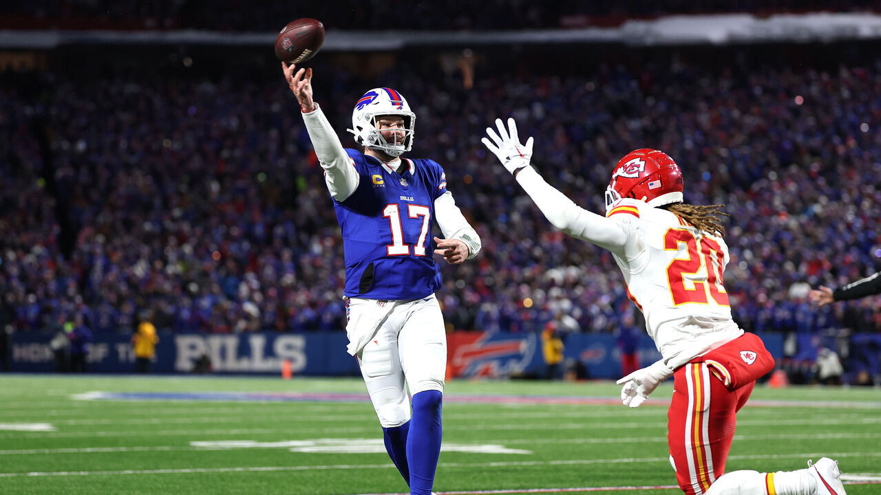 ORCHARD PARK, NEW YORK - JANUARY 21: Josh Allen #17 of the Buffalo Bills throws a pass against Justin Reid #20 of the Kansas City Chiefs during the third quarter in the AFC Divisional Playoff game at Highmark Stadium on January 21, 2024 in Orchard Park, New York.