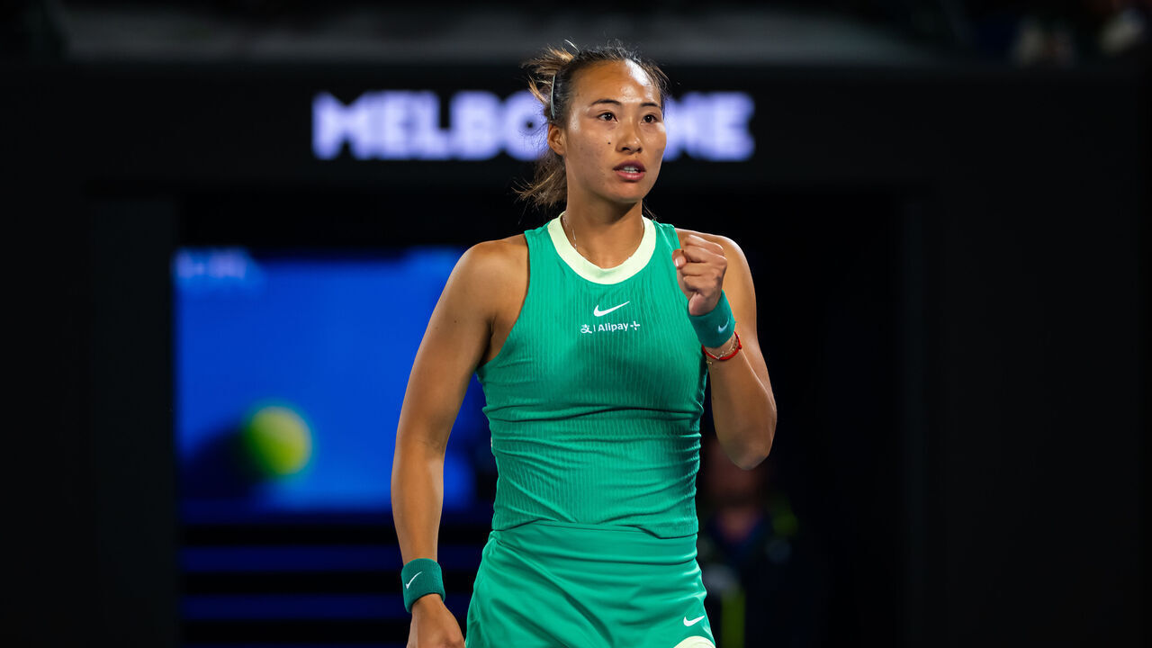 MELBOURNE, AUSTRALIA - JANUARY 22: Qinwen Zheng of China in action against Oceane Dodin of France in the fourth round on Day 9 of the 2024 Australian Open at Melbourne Park on January 22, 2024 in Melbourne, Australia