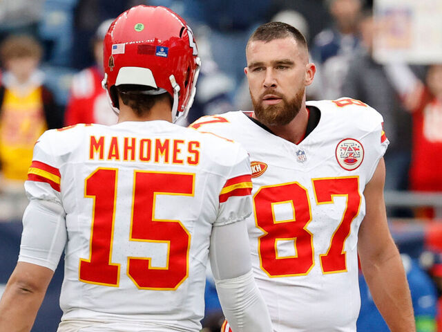 FOXBOROUGH, MA - DECEMBER 17: Kansas City Chiefs quarterback Patrick Mahomes (15) and Kansas City Chiefs tight end Travis Kelce (87) in warm up before a game between the New England Patriots and the Kansas City Chiefs on December 17, 2023, at Gillette Stadium in Foxborough, Massachusetts.
