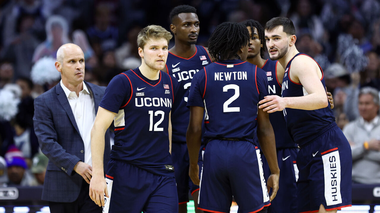 PHILADELPHIA, PENNSYLVANIA - JANUARY 20: Cam Spencer #12 of the Connecticut Huskies looks on with teammates during the second half against the Villanova Wildcats at the Wells Fargo Center on January 20, 2024 in Philadelphia, Pennsylvania.