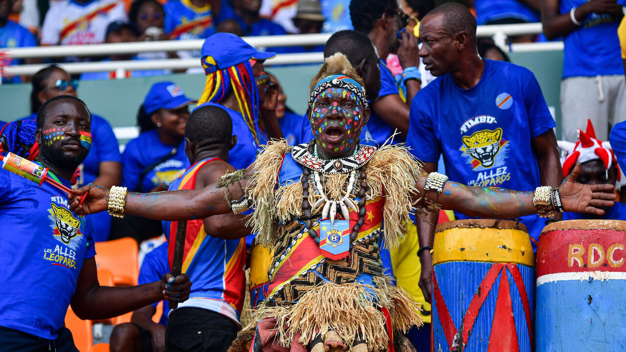 A DR Congo's supporter, wearing costume, gestures ahead of the Africa Cup of Nations (CAN) 2024 group F football match between Morocco and DR Congo at Stade Laurent Pokou in San Pedro on January 21, 2024.
