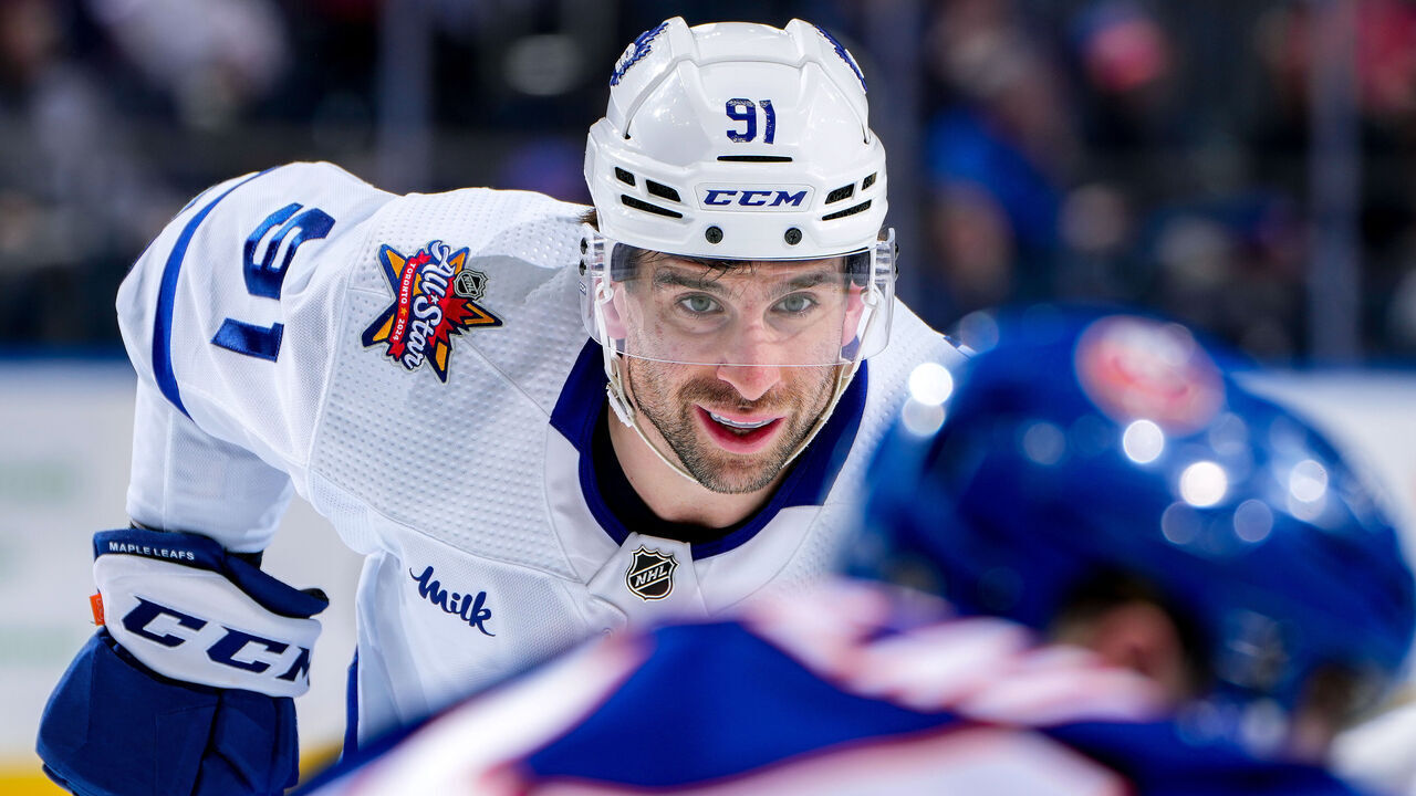 ELMONT, NEW YORK - JANUARY 11: John Tavares #91 of the Toronto Maple Leafs waits for play to begin against the New York Islanders during the second period at UBS Arena on January 11, 2024 in Elmont, New York.
