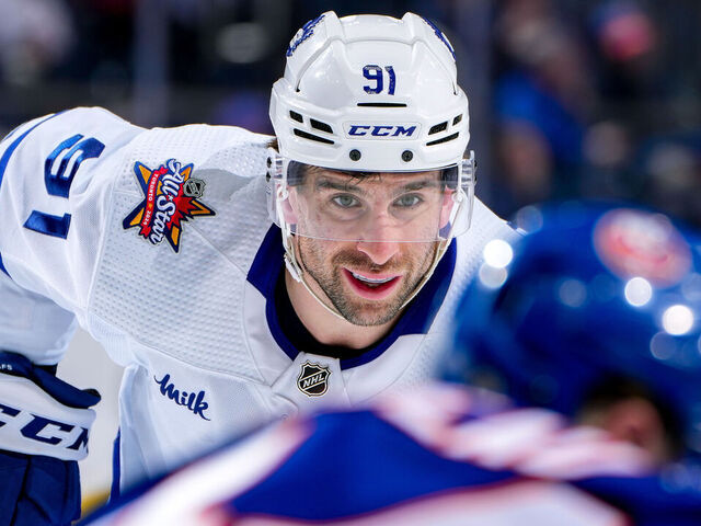 ELMONT, NEW YORK - JANUARY 11: John Tavares #91 of the Toronto Maple Leafs waits for play to begin against the New York Islanders during the second period at UBS Arena on January 11, 2024 in Elmont, New York.