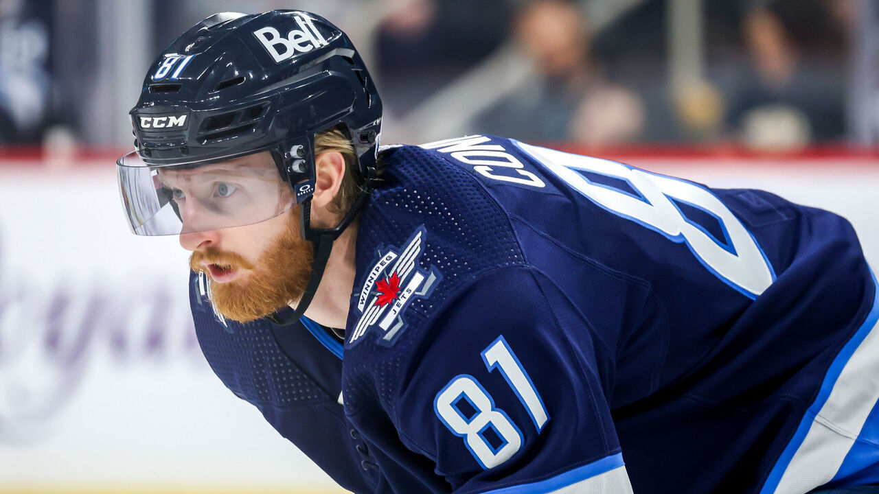 WINNIPEG, CANADA - JANUARY 16: Kyle Connor #81 of the Winnipeg Jets looks on as he gets set during a first period face-off against the New York Islanders at the Canada Life Centre on January 16, 2024 in Winnipeg, Manitoba, Canada.