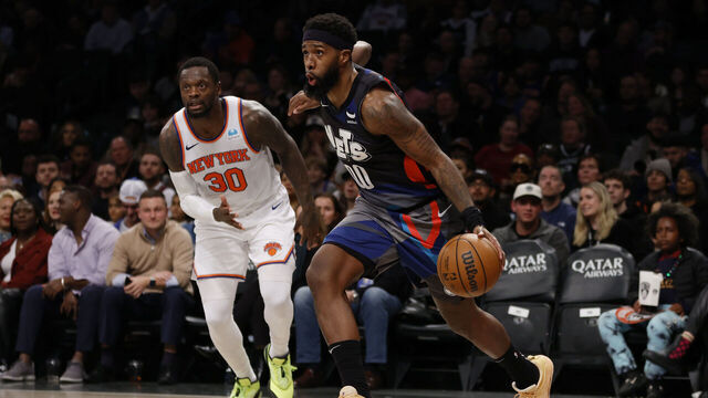 NEW YORK, NEW YORK - DECEMBER 20: Royce O'Neale #00 of the Brooklyn Nets dribbles as Julius Randle #30 of the New York Knicks defends during the first half at Barclays Center on December 20, 2023 in the Brooklyn borough of New York City. NOTE TO USER: User expressly acknowledges and agrees that, by downloading and/or using this Photograph, user is consenting to the terms and conditions of the Getty Images License Agreement.