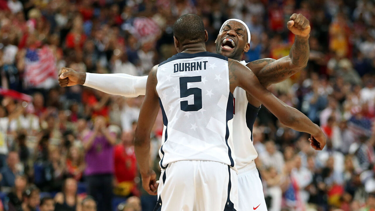 LONDON, ENGLAND - AUGUST 12: Kevin Durant #5 and LeBron James #6 of the United States celebrate in the Men's Basketball gold medal game between the United States and Spain on Day 16 of the London 2012 Olympics Games at North Greenwich Arena on August 12, 2012 in London, England.