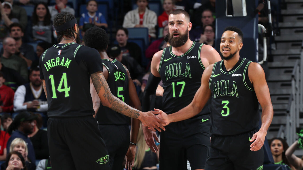 NEW ORLEANS, LA - JANUARY 23: Brandon Ingram #14 high fives CJ McCollum #3 of the New Orleans Pelicans during the game against the Utah Jazz on January 23, 2024 at the Smoothie King Center in New Orleans, Louisiana. Mandatory Copyright Notice: Copyright 2024 NBAE