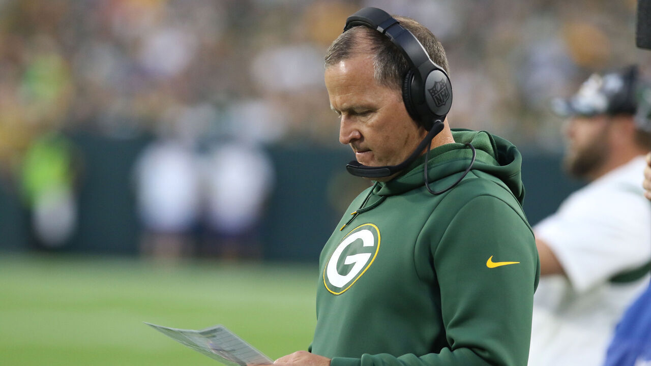 GREEN BAY, WI - AUGUST 19: Green Bay Packers defensive coordinator Joe Barry looks at his play sheet during an NFL preseason game between the Green Bay Packers and the New Orleans Saints on August 19, 2022, at Lambeau Field in Green Bay, WI.
