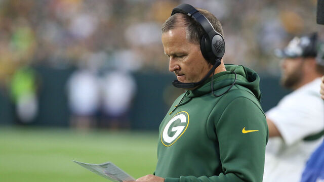 GREEN BAY, WI - AUGUST 19: Green Bay Packers defensive coordinator Joe Barry looks at his play sheet during an NFL preseason game between the Green Bay Packers and the New Orleans Saints on August 19, 2022, at Lambeau Field in Green Bay, WI.