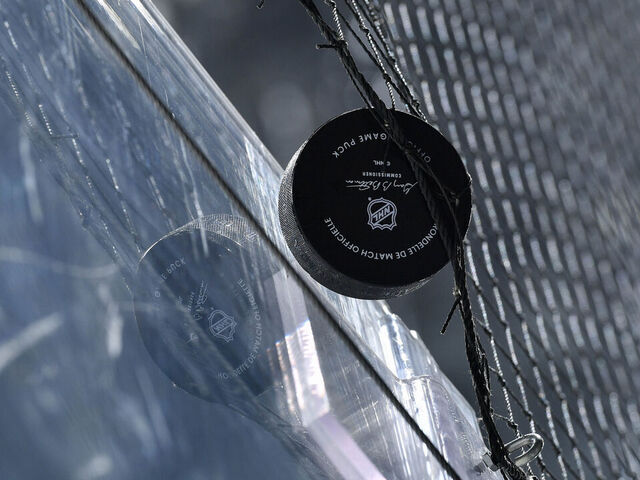 LOS ANGELES, CA - JANUARY 22: A detail shot of the official game puck stuck in the net during the first period between the San Jose Sharks and the Los Angeles Kings at Crypto.com Arena on January 22, 2024 in Los Angeles, California.