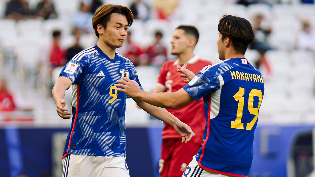 DOHA, QATAR - JANUARY 24: Ayase Ueda #9 of Japan celebrates with teammates after scoring his team's first goal during the AFC Asian Cup Qatar 2023 Group D match between Japan and Indonesia at the Al Thumama Stadium on January 24, 2024 in Doha, Qatar.