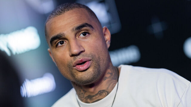 22 January 2024, North Rhine-Westphalia, Cologne: Kevin-Prince Boateng, team manager of the Käfigtiger, stands next to the pitch at Motorworld. Mats Hummels and Lukas Podolski's new small-sided league, the Baller League, starts its first season. Photo: Rolf Vennenbernd/dpa