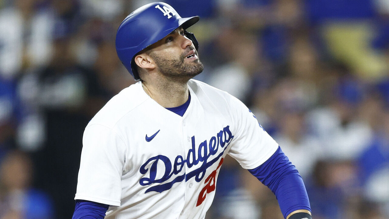 LOS ANGELES, CALIFORNIA - OCTOBER 09: J.D. Martinez #28 of the Los Angeles Dodgers hits a solo home run against the Arizona Diamondbacks during the fourth inning in Game Two of the Division Series at Dodger Stadium on October 09, 2023 in Los Angeles, California.
