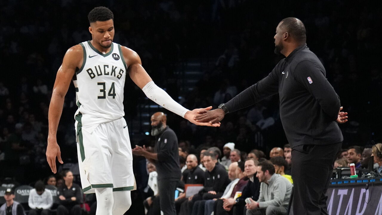 BROOKLYN, NY - DECEMBER 27: Giannis Antetokounmpo #34 high fives Head Coach Adrian Griffin of the Milwaukee Bucks during the game against the Brooklyn Nets on December 27, 2023 at Barclays Center in Brooklyn, New York. Mandatory Copyright Notice: Copyright 2023 NBAE