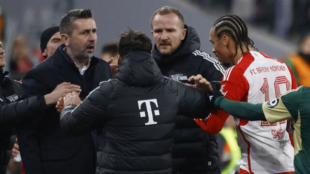 Bayern Munich's German forward #10 Leroy Sane (3R) and Union Berlin's Croatian head coach Nenad Bjelica (2L) react during an altercation during the German first division Bundesliga football match between FC Bayern Munich and Union Berlin in Munich on January 24, 2024.
