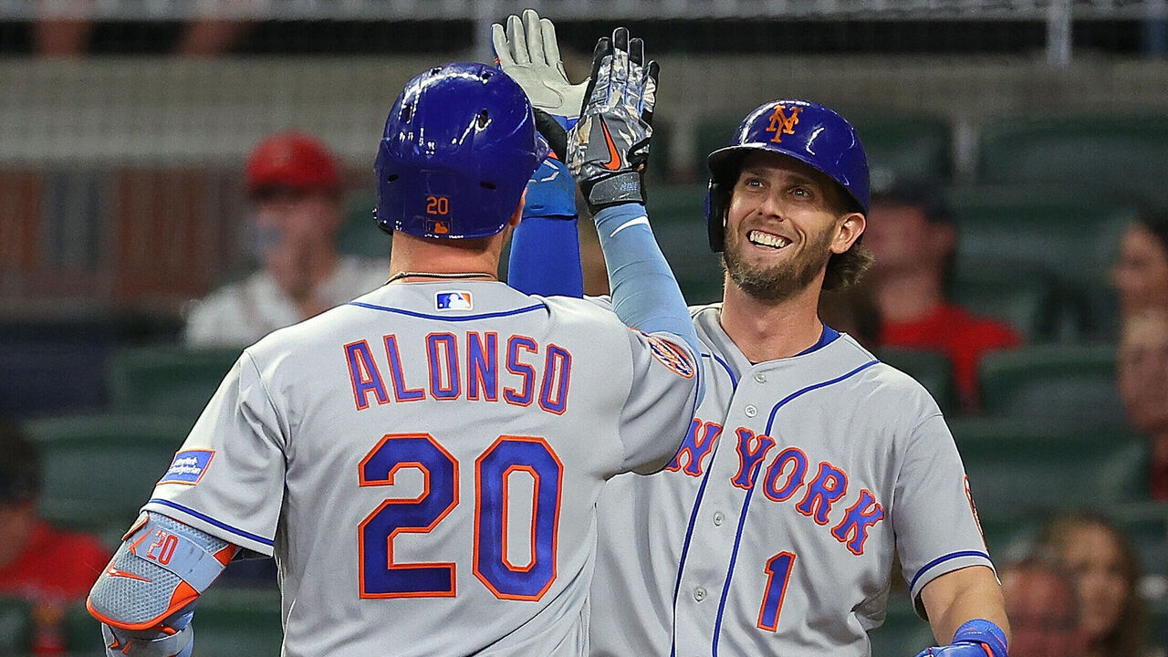 ATLANTA, GEORGIA - JUNE 06: Pete Alonso #20 of the New York Mets reacts with Jeff McNeil #1 after hitting a two-run homer in the third inning against the Atlanta Braves at Truist Park on June 06, 2023 in Atlanta, Georgia.