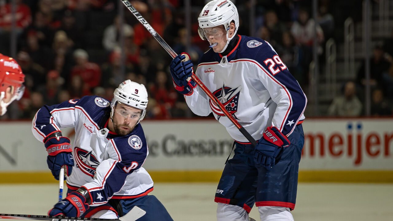DETROIT, MI - NOVEMBER 11: Ivan Provorov #9 of the Columbus Blue Jackets in front of Patrik Laine #29 during the second period against the Detroit Red Wings at Little Caesars Arena on November 11, 2023 in Detroit, Michigan. Detroit defeated Columbus 5-4.
