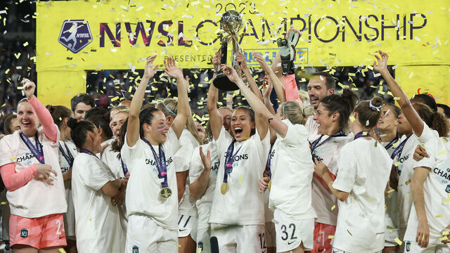 SAN DIEGO, CALIFORNIA - NOVEMBER 11: Kristen Edmonds #12 of NJ/NY Gotham FC raises the NWSL Championship trophy after defeating the OL Reign during the 2023 NWSL Championship game at Snapdragon Stadium on November 11, 2023 in San Diego, California.