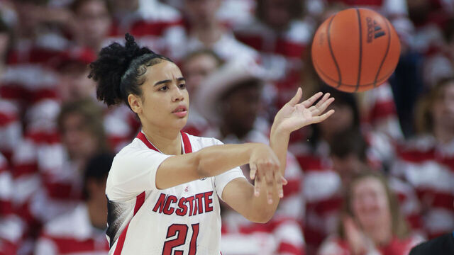 RALEIGH, NC - JANUARY 21: NC State Wolfpack guard Madison Hayes (21) passes up the court during the college basketball game between the NC State Wolfpack and the Duke Blue Devils on January 21, 2024 at Reynolds Coliseum in Raleigh, NC.