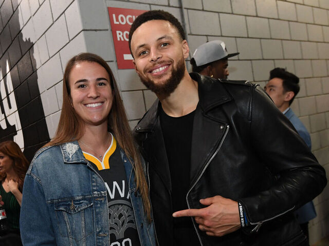 PORTLAND, OR - MAY 20: Stephen Curry #30 of the Golden State Warriors poses for a photo with Oregon Ducks Basketball player, Sabrina Ionescu, after advancing to the NBA Finals against the Portland Trail Blazers during Game Four of the Western Conference Finals on May 20, 2019 at the Moda Center in Portland, Oregon. NOTE TO USER: User expressly acknowledges and agrees that, by downloading and/or using this photograph, user is consenting to the terms and conditions of the Getty Images License Agreement. Mandatory Copyright Notice: Copyright 2019 NBAE