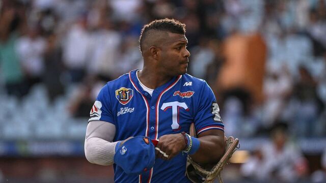 Tiburones de la Guaira's Cuban baseball player Yasiel Puig walks off the infield during the Venezuelan Baseball League game between Leones del Caracas and Tiburones de la Guaira at the Simon Bolivar Monumental Stadium in Caracas, on January 7, 2024.